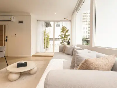 a living room with a couch and a table at 3 Bedroom for 6 Guests Family in the Heart of Sathorn in Bangkok