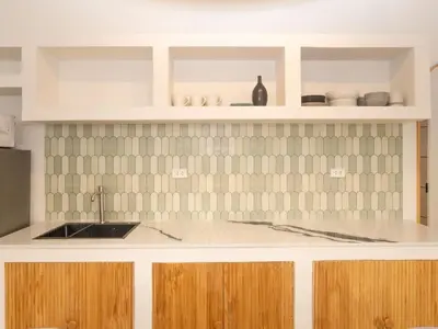 a kitchen with a sink and a counter at 3 Bedroom for 6 Guests Family in the Heart of Sathorn in Bangkok