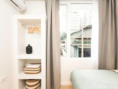 a bedroom with a bed and a window at 3 Bedroom for 6 Guests Family in the Heart of Sathorn in Bangkok