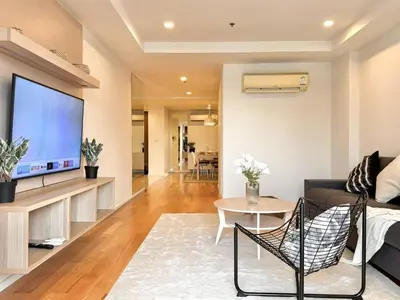 a living room with a large flat screen tv at 3BD3BA Condo|City View|Hot Tub|7-11, PoolGym, Mall in Makkasan