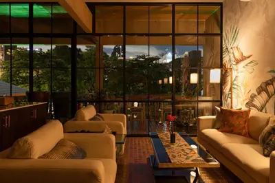 a living room with couches and a large window at Presidential Suite | 5 min BTS, Sun-Room| 159sqm in Khlong Toei