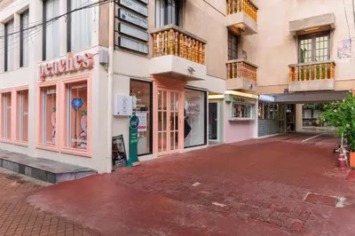 an empty street in front of a building at Chic 1BR |5 min BTS, 2 min to spa|500Mbps&bath-tub in Khlong Toei