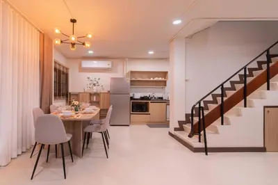 a dining room and kitchen with a table and chairs at ThongLor|Spacious 4BR4BA, Fast-WiFi, Netflix, Shop in Khlong Toei
