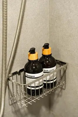 two bottles in a rack in a refrigerator at Cozy 3BR for 8 People, 5Mins from MRT Huai Khwang in Bangkok