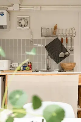 a kitchen with a sink and a counter with utensils at 2BR APT on 2nd floor for 6 ppl in Bangkok