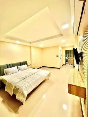a bedroom with a large bed in a room at The Little Apartment in Bangkok