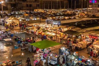 an overhead view of an outdoor market at night at The Little Apartment in Bangkok