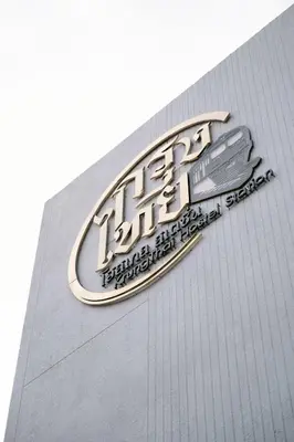 a sign on the side of a building at กรุงไทย โฮสเทล สเตชั่น in Thonhuri