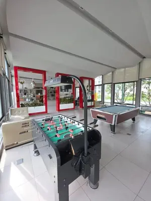 a room with a pool table and ping pong ball at FavStay Ramkhamhaeng, Stylish 1BR Bangkok in Bangkok