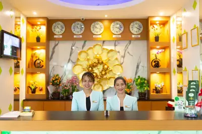 two women standing behind a counter in a store at Lucky Green View in Bangkok