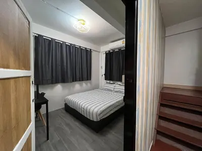 a small bedroom with a bed and a window at LA CASA in China town in Bangkok