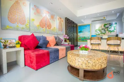 a living room with a couch and a table at Pho Place in Bangkok