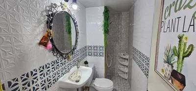 a bathroom with a sink and a mirror and a toilet at Hotel pretty rooms in Pak Kret