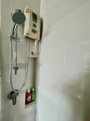 a shower in a bathroom with a shower head at Sky View at The Parkland Ngamwongwan-Khae Rai by Orn in Nonthaburi