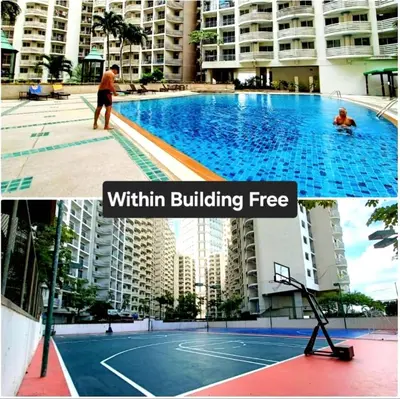 a man playing tennis in a swimming pool in a building at River View Bangkok Apartment in Bangkok