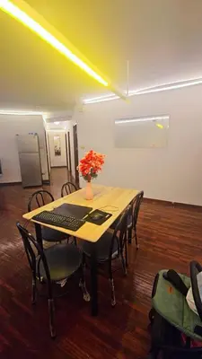 a conference room with a table with a keyboard and chairs at River View Bangkok Apartment in Bangkok