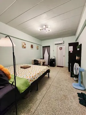 a bedroom with a bed and a living room at 706-STP Homely room Free Wi-Fi and Near BTS in Bangkok
