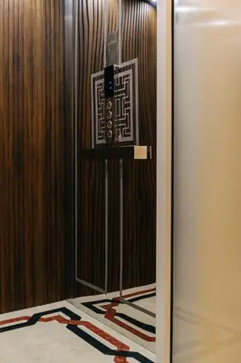 a door with a sign on it in a room at Samranscape in Bangkok