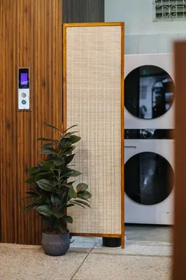 a mirror next to a plant next to a microwave at Samranscape in Bangkok