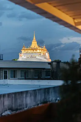 a large cruise ship with a building in the background at Samranscape in Bangkok