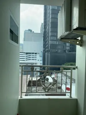 a balcony with a view of a city at KS RESIDENCE Victory Monument in Bangkok