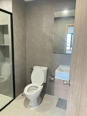 a bathroom with a toilet and a sink and a tub at Stay in near International airport in Bangkok