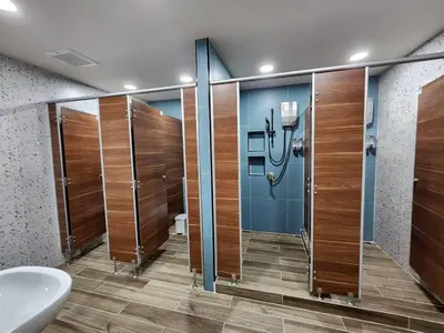 a bathroom with a shower and a toilet and a sink at CozyTwin Bed วิวระเบียง เจริญนคร in Bangkok