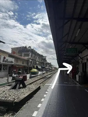 a train station with a white arrow on the platform at best 148 train staytion in Godown