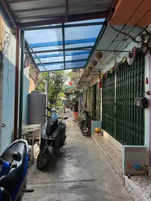 a group of motorcycles parked outside of a building at best 148 train staytion in Godown