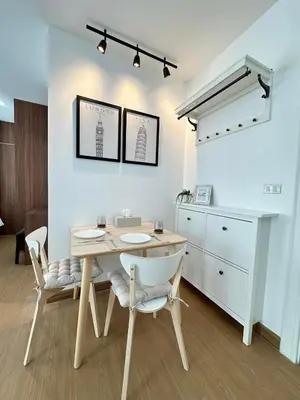 a dining room with a table and chairs and a kitchen at 6th Avenue Sukhumvit BKK 403 BTS Asoke Nana MRT Sukhumvit in Bangkok