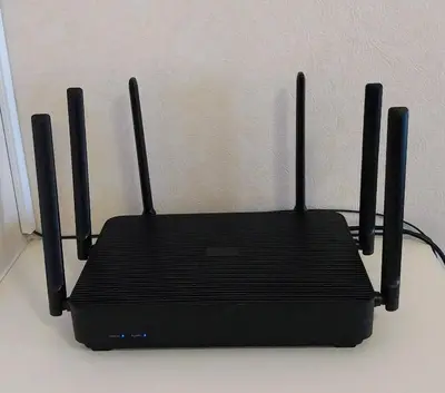 a black router sitting on top of a table at Riverview Condo Near Icon Siam Hi Speed Internet in Rat Burana