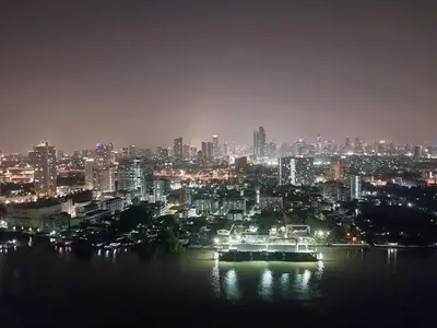 a view of a city at night with at Riverview Condo Near Icon Siam Hi Speed Internet in Rat Burana