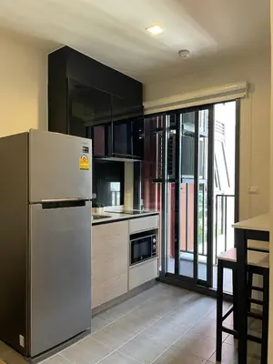 a kitchen with a stainless steel refrigerator and a window at Private in Bangkapi in Bangkok