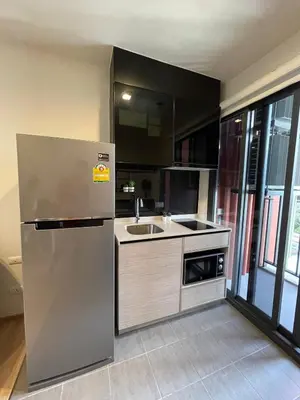 a kitchen with a stainless steel refrigerator and a sink at Private in Bangkapi in Bangkok