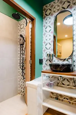 a bathroom with a sink and a mirror at TermSuk Apt- Banthat Thong in Bangkok