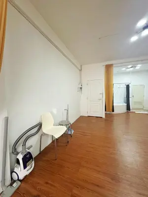 an empty room with a table and a chair in it at Spacious, just an 850m walk to MRT Rama 9 station in Bangkok