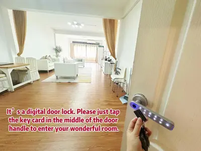 a person holding a door handle in a living room at Spacious, just an 850m walk to MRT Rama 9 station in Bangkok