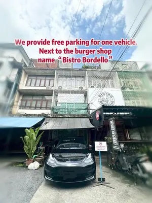 a car parked in front of a building at Spacious, just an 850m walk to MRT Rama 9 station in Bangkok
