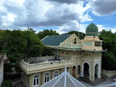 a building with a green dome on top of it at Bangluang Boutique Hotel in Bangkok