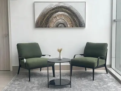 two chairs and a table in a room at UTD8 Hotel and Residence in Bangkok