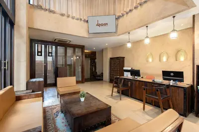 an office lobby with a desk and chairs at Dewan Bangkok in Bangkok