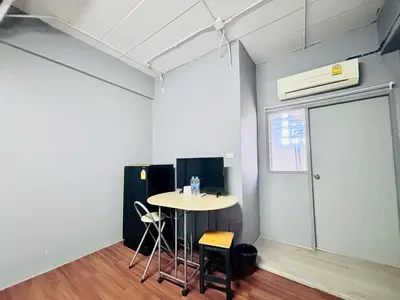 an empty room with a table and a window at Onnut36 Apartment Panasan in Amphoe Phra Khanong
