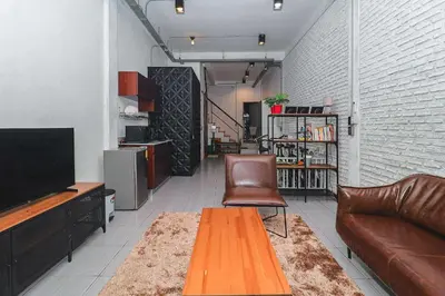 a living room with a couch and a television at Rose Loft Family or friends 6 person in Thonhuri
