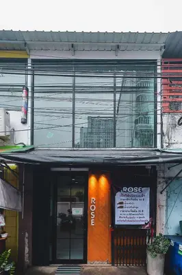 a building with an orange door with a sign on it at Rose Loft Family or friends 6 person in Thonhuri