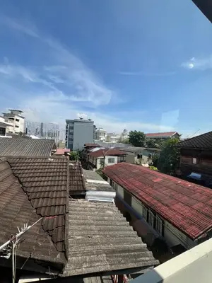 an overhead view of roofs of buildings in a city at BNK89 Hostel in Bangkok
