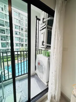 a balcony with a view of a pool at Bangkok apartment in Bangkok