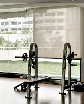 a gym with two treadmills and a large window at New Renovated 2 Beds Amazing Balcony View Nana BTS in Bangkok