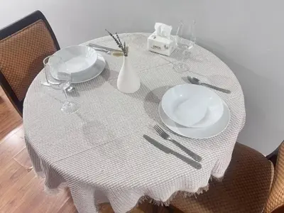 a white table with two plates and glasses on it at Sukhumvit soi 4 Apartment Center of BKK in Bangkok