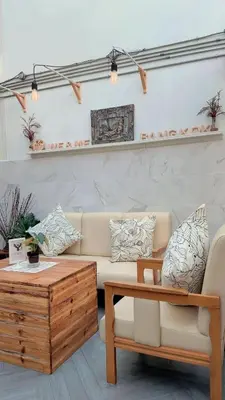 a living room with a couch and a coffee table at TWH Hostel Bangkok in Bangkok