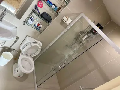 a bathroom with a toilet and a sink at 1 bd at s&s sukhumbit in Amphoe Phra Khanong